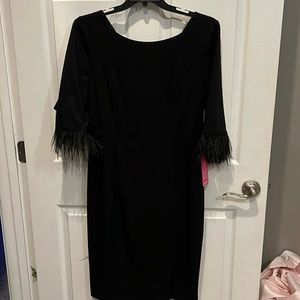 Adrianna Papell black dress with feather on edge of sleeves and front slit
